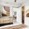 bedroom with dresser art on the walls and a window