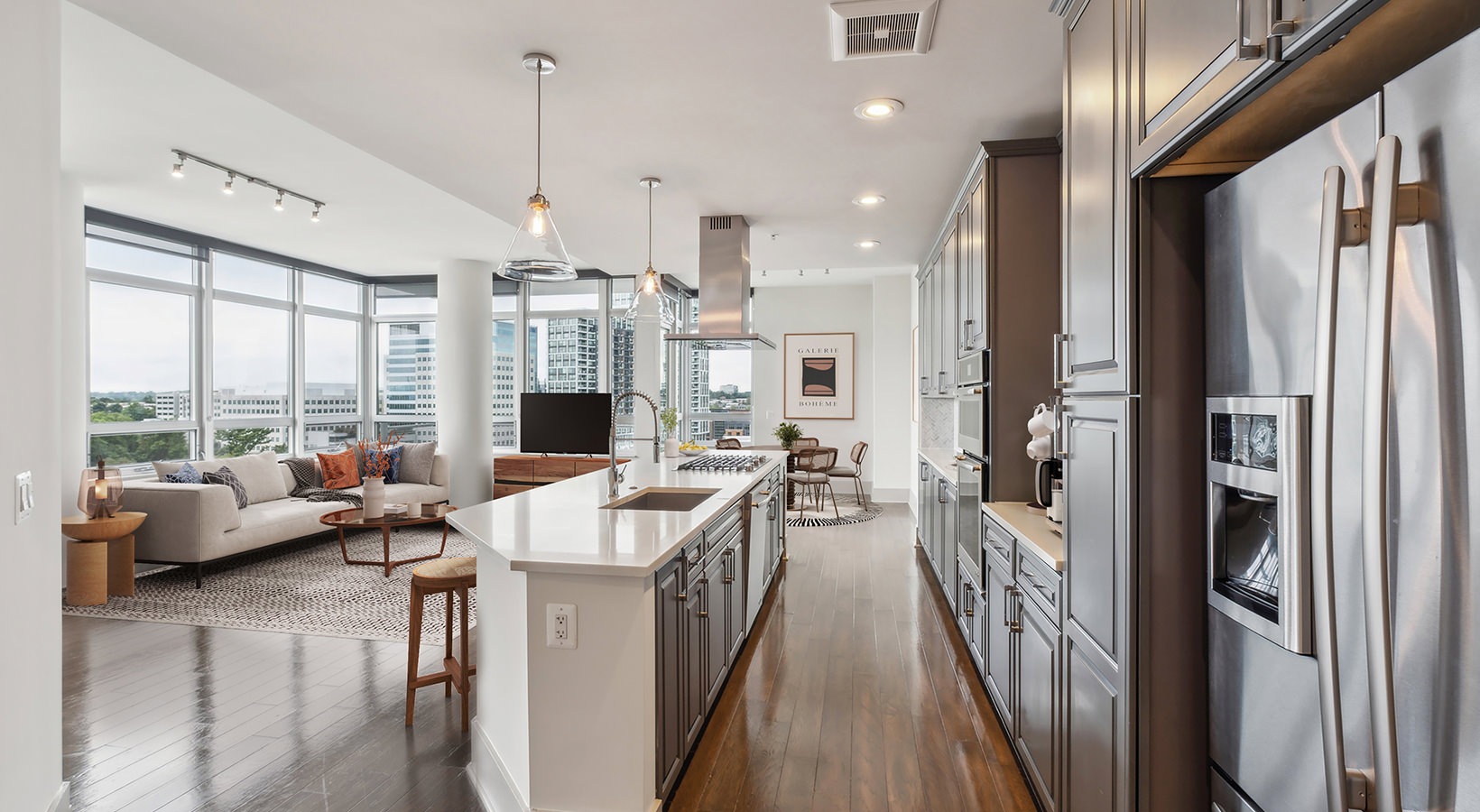 kitchen with large island hardwood floors and stainless steel appliances