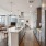 kitchen with large island hardwood floors and stainless steel appliances