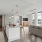 kitchen with large island and view of living room with large windows