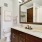 bathroom with sink and large mirror