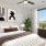 bedroom with bed wall art and large window